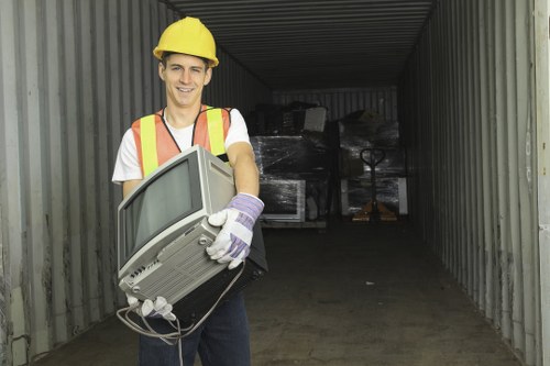 Segregated recycling bins for paper, plastic and food waste during office clearance